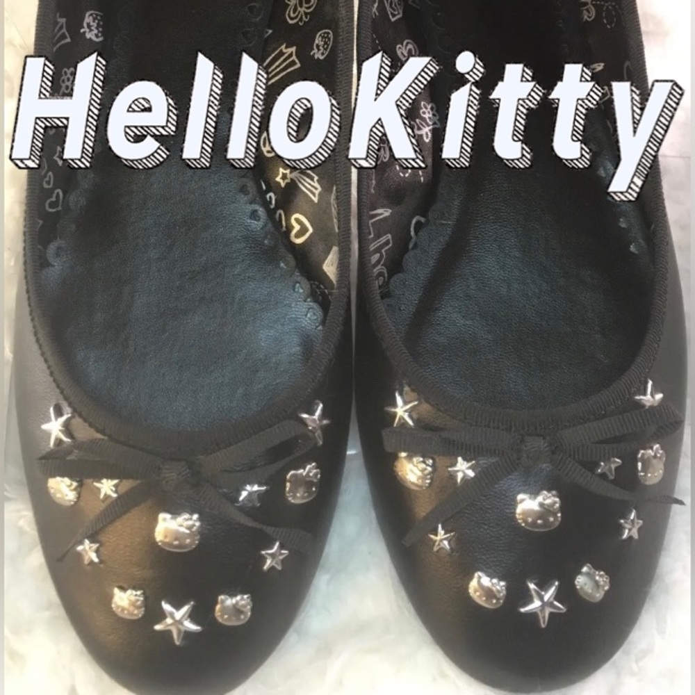 Hello Kitty black leather ballet flats with charms. Size 7